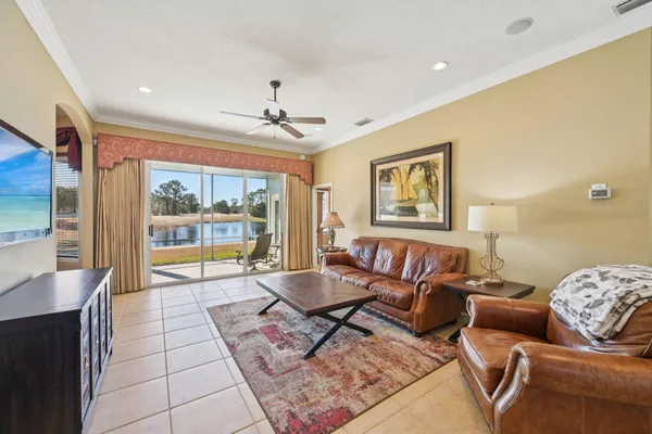 a bathroom with a granite countertop sink toilet a mirror a vanity and shower