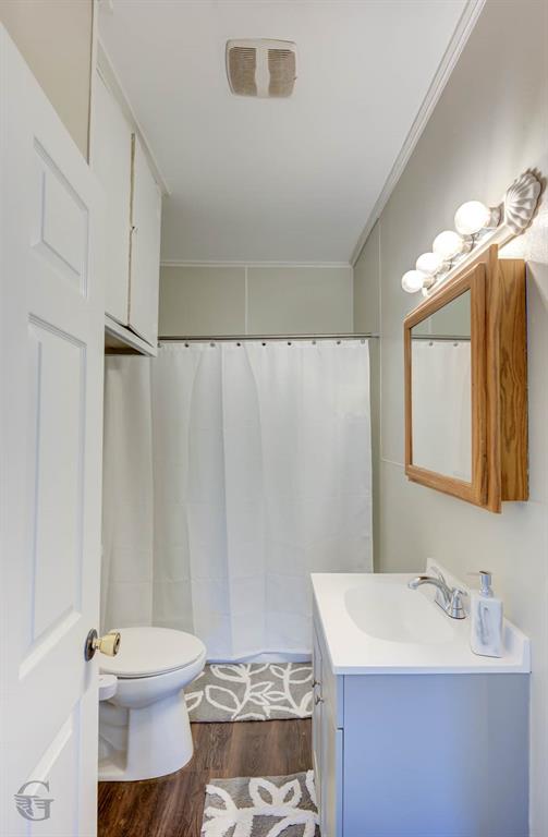 511 Chandler Street Minden, LA 71055 - Photo 11 of 16 a bathroom with a sink toilet and mirror