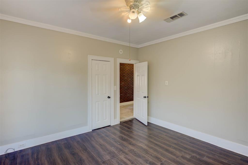 511 Chandler Street Minden, LA 71055 - Photo 15 of 16 a view of an empty room with wooden floor