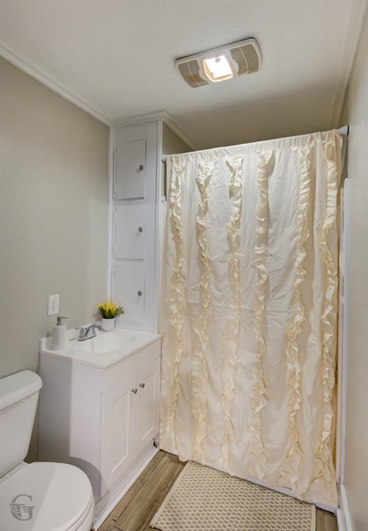 511 Chandler Street Minden, LA 71055 - Photo 16 of 16 a bathroom with a sink toilet and a mirror