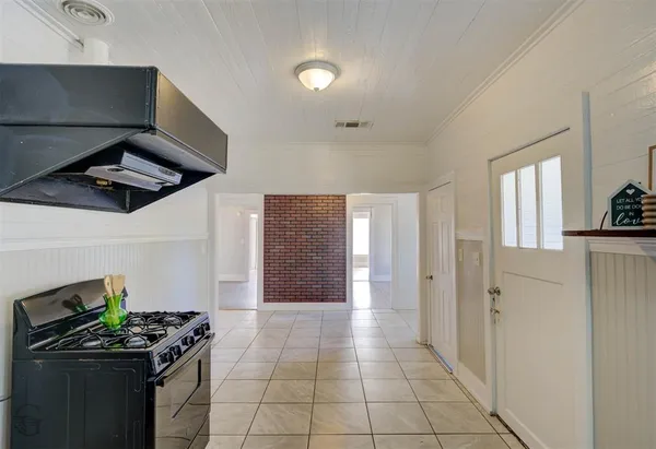 a kitchen with stainless steel appliances granite countertop a stove and a cabinets