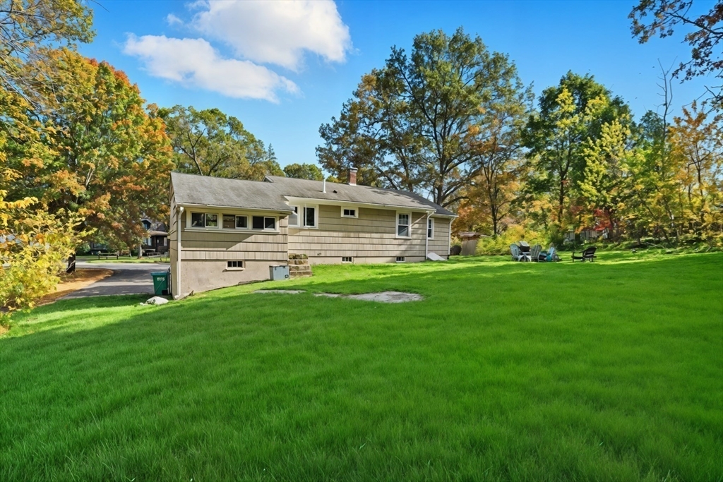 684 Haverhill Street Reading, MA 01867 - Photo 15 of 16 a view of a house with a yard