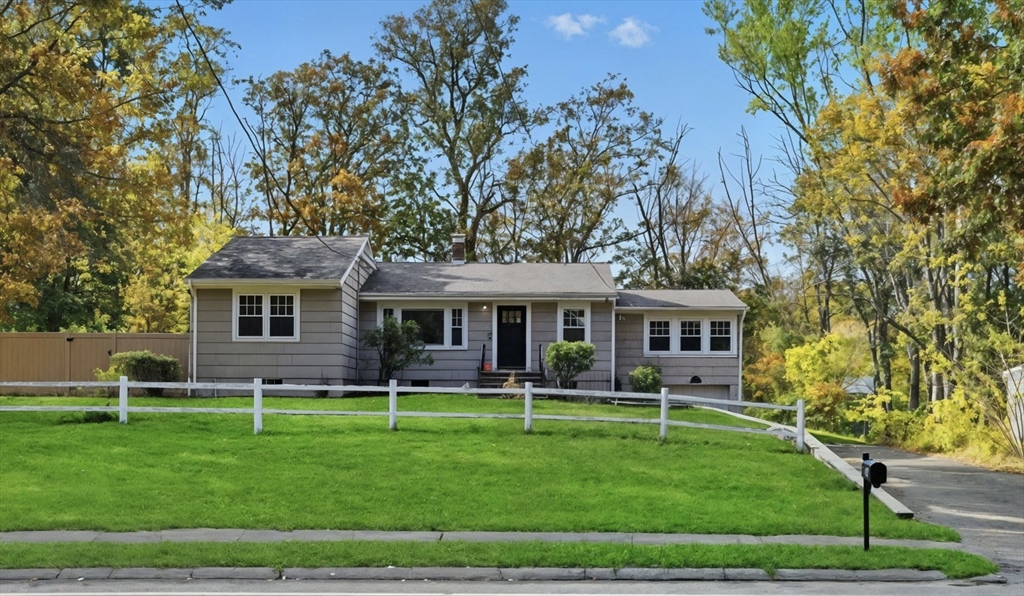684 Haverhill Street Reading, MA 01867 - Photo 16 of 16 a front view of a house with a yard