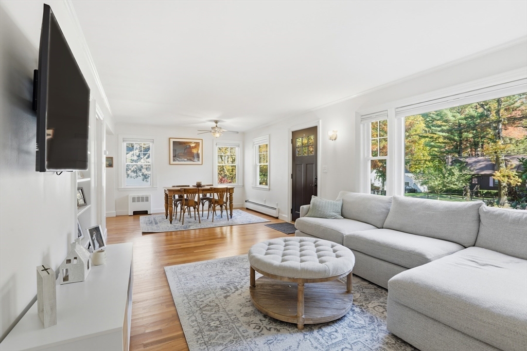684 Haverhill Street Reading, MA 01867 - Photo 4 of 16 a living room with furniture and a flat screen tv