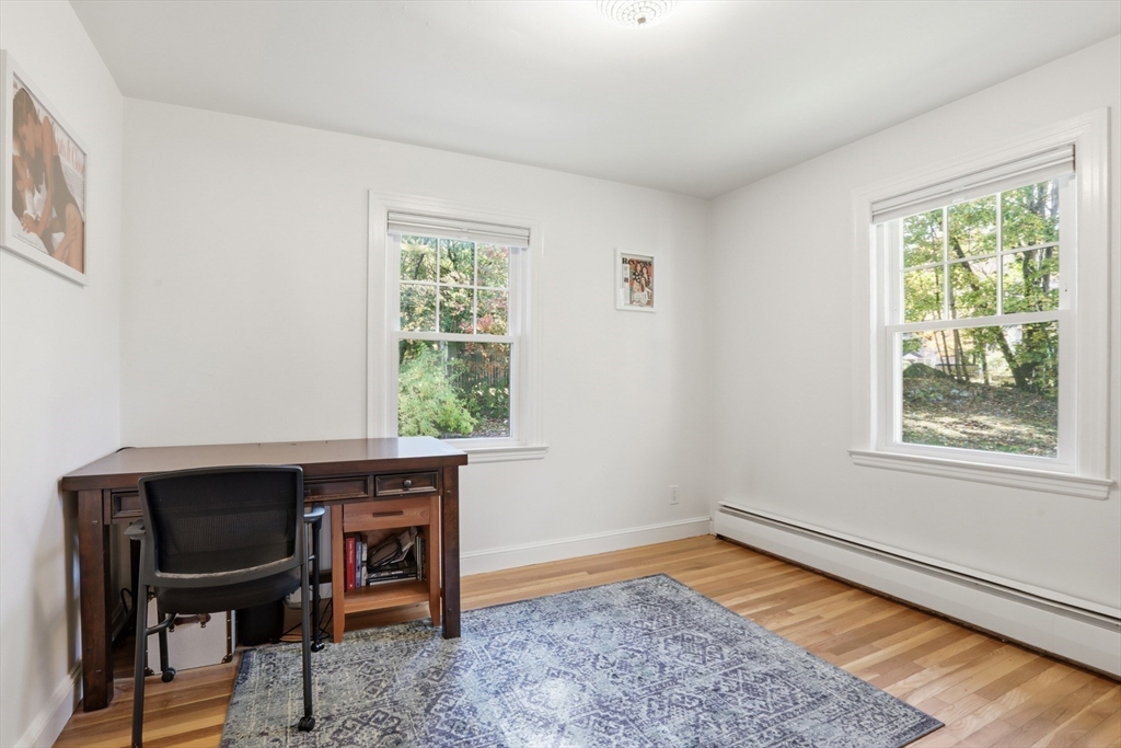 684 Haverhill Street Reading, MA 01867 - Photo 10 of 16 a room that has a window and a chair in it