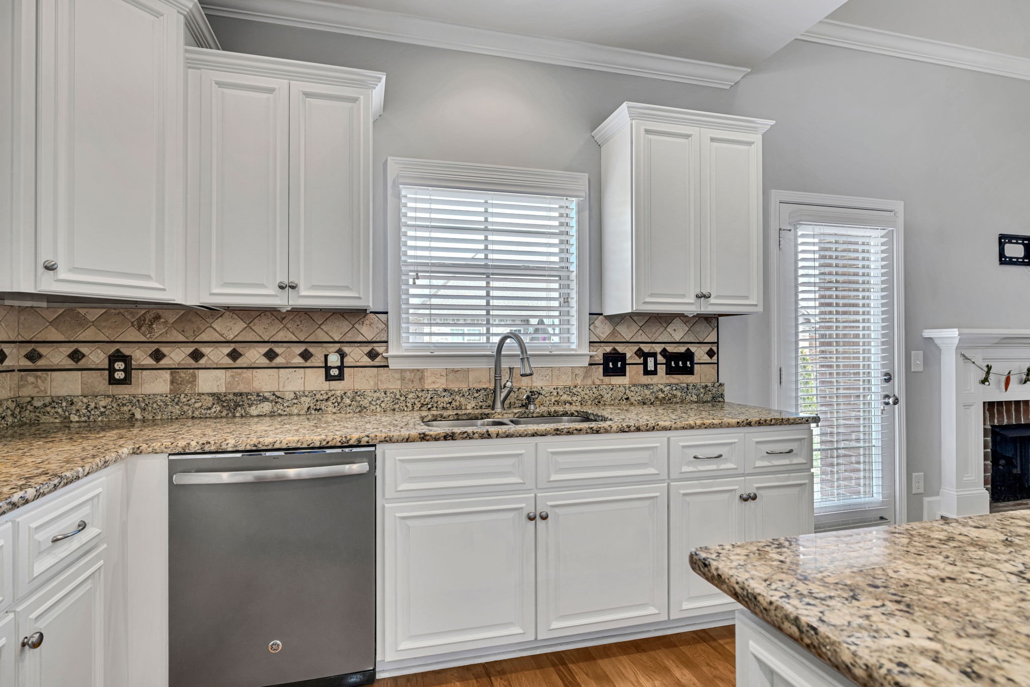 8023 Ragusa Circle Spring Hill, TN 37174 - Photo 19 of 46 a kitchen with granite countertop white cabinets and white appliances