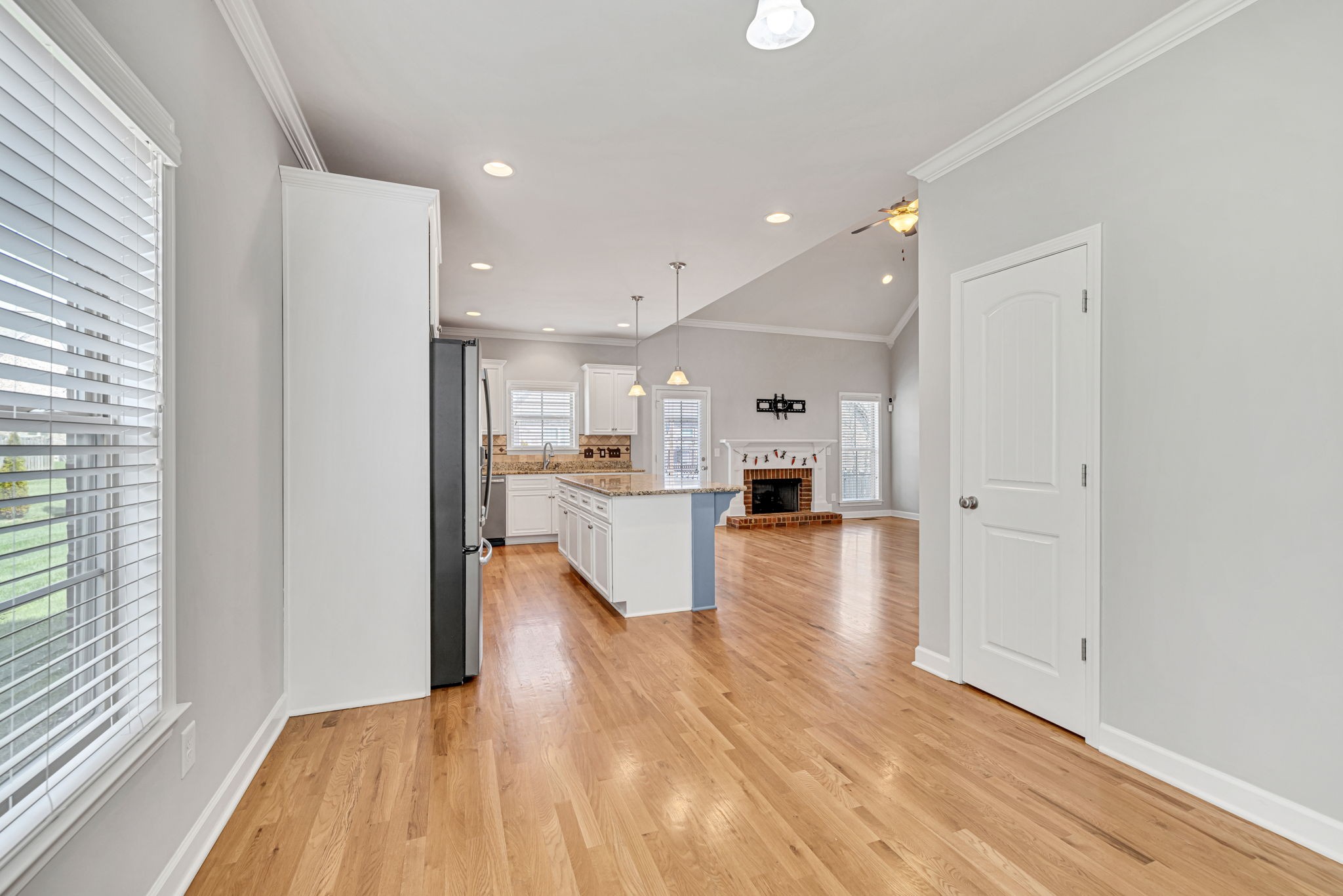 8023 Ragusa Circle Spring Hill, TN 37174 - Photo 23 of 46 a view of kitchen dining table chairs microwave and cabinets