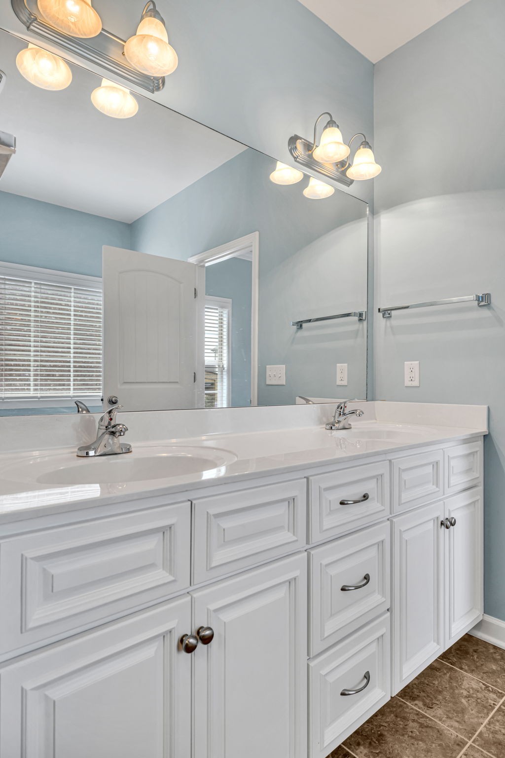 8023 Ragusa Circle Spring Hill, TN 37174 - Photo 30 of 46 a bathroom with a sink vanity and a mirror