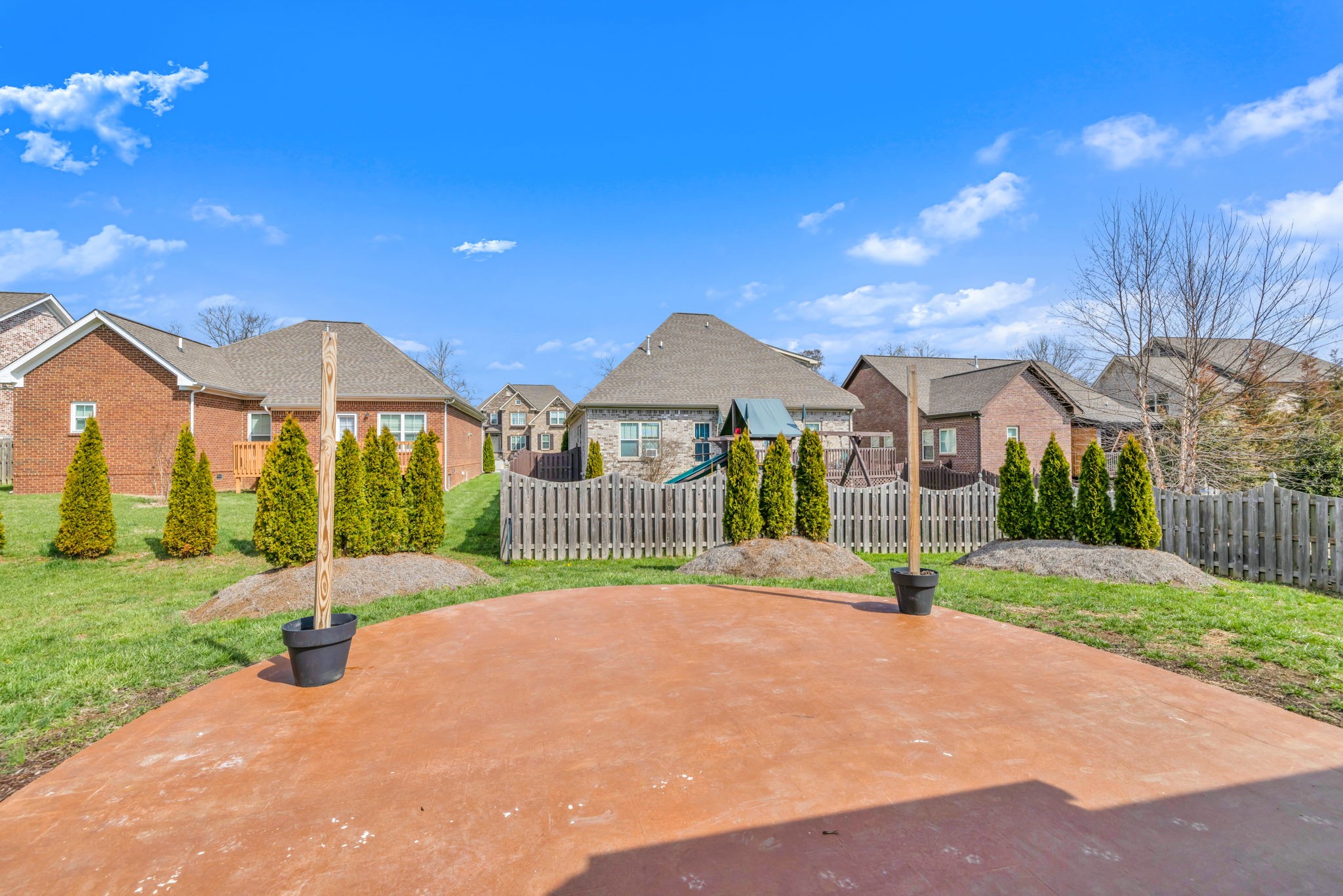 8023 Ragusa Circle Spring Hill, TN 37174 - Photo 43 of 46 a view of a house with a yard and potted plants