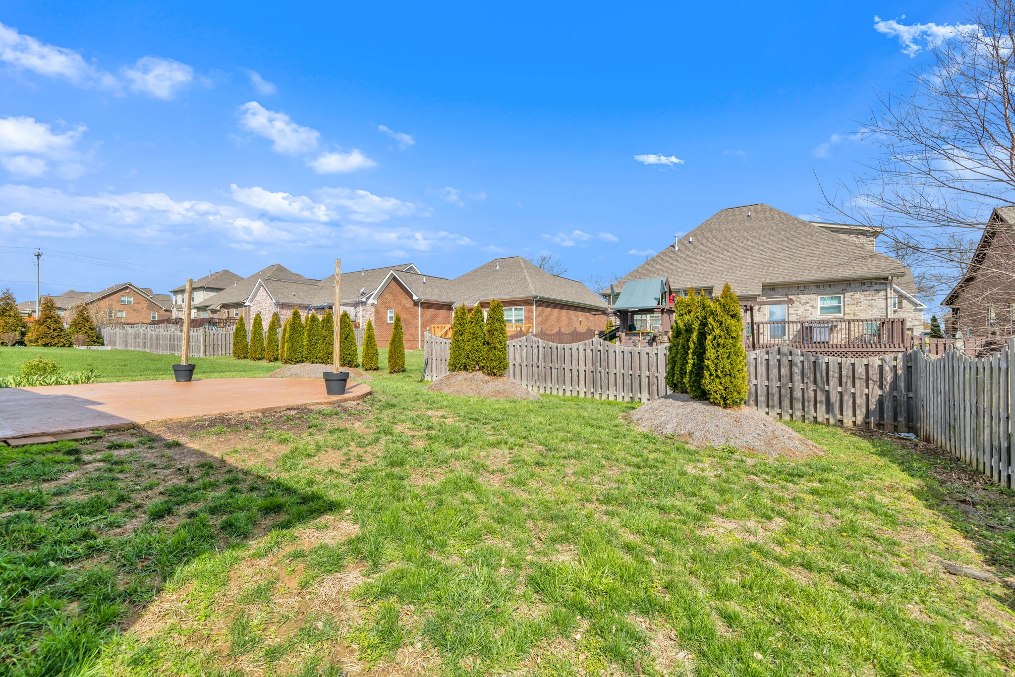 8023 Ragusa Circle Spring Hill, TN 37174 - Photo 45 of 46 a view of a garden with a house in the background