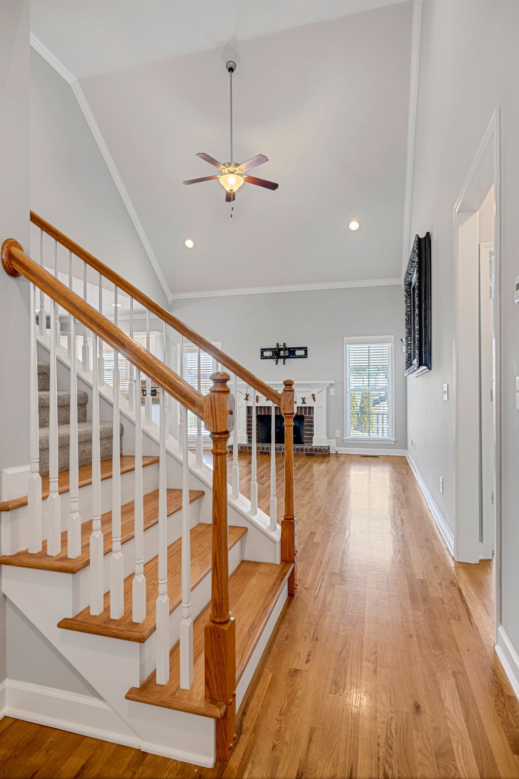 8023 Ragusa Circle Spring Hill, TN 37174 - Photo 5 of 46 a view of a living room with wooden floor and ceiling fan