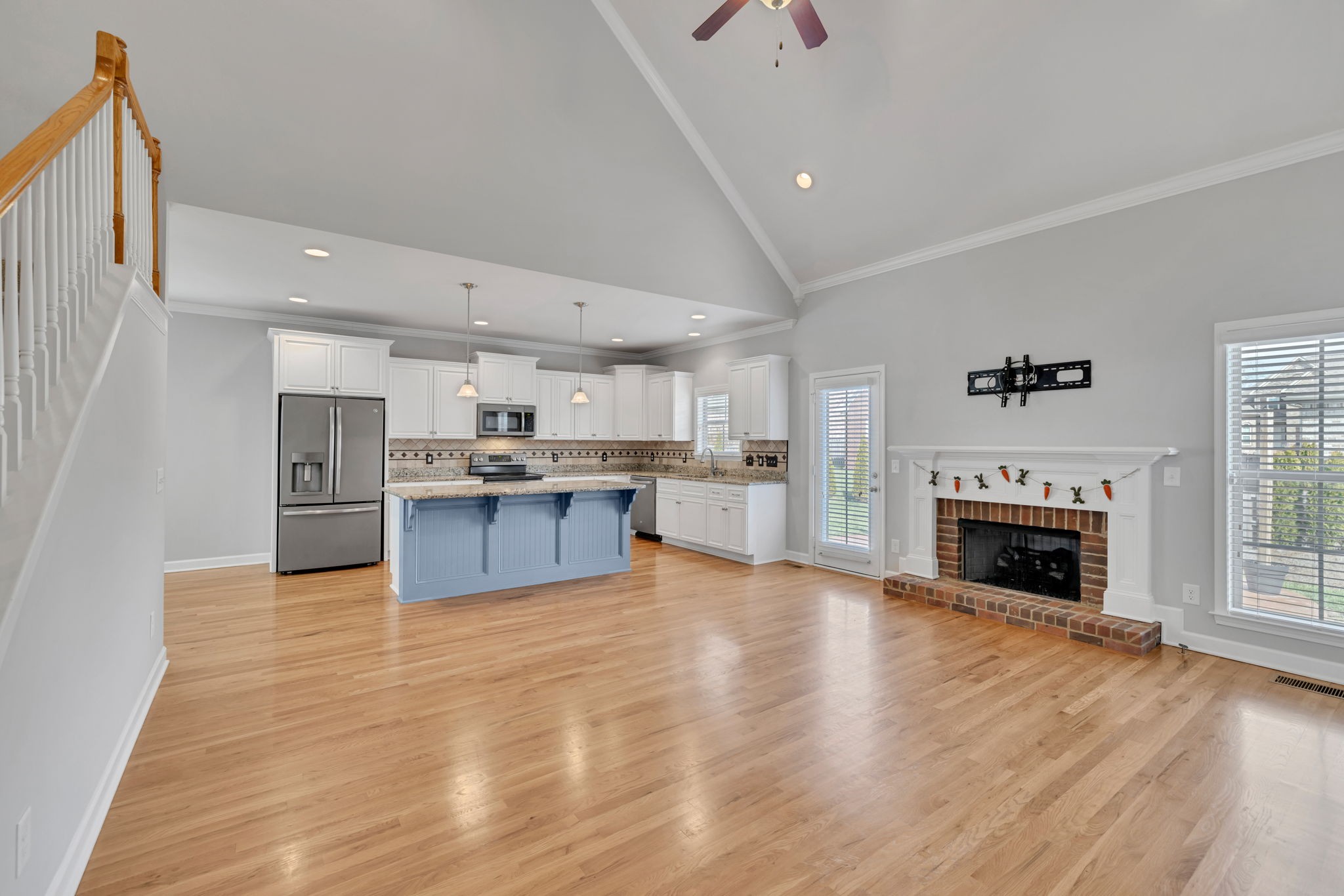 8023 Ragusa Circle Spring Hill, TN 37174 - Photo 7 of 46 a view of kitchen with granite countertop stainless steel appliances and a fireplace
