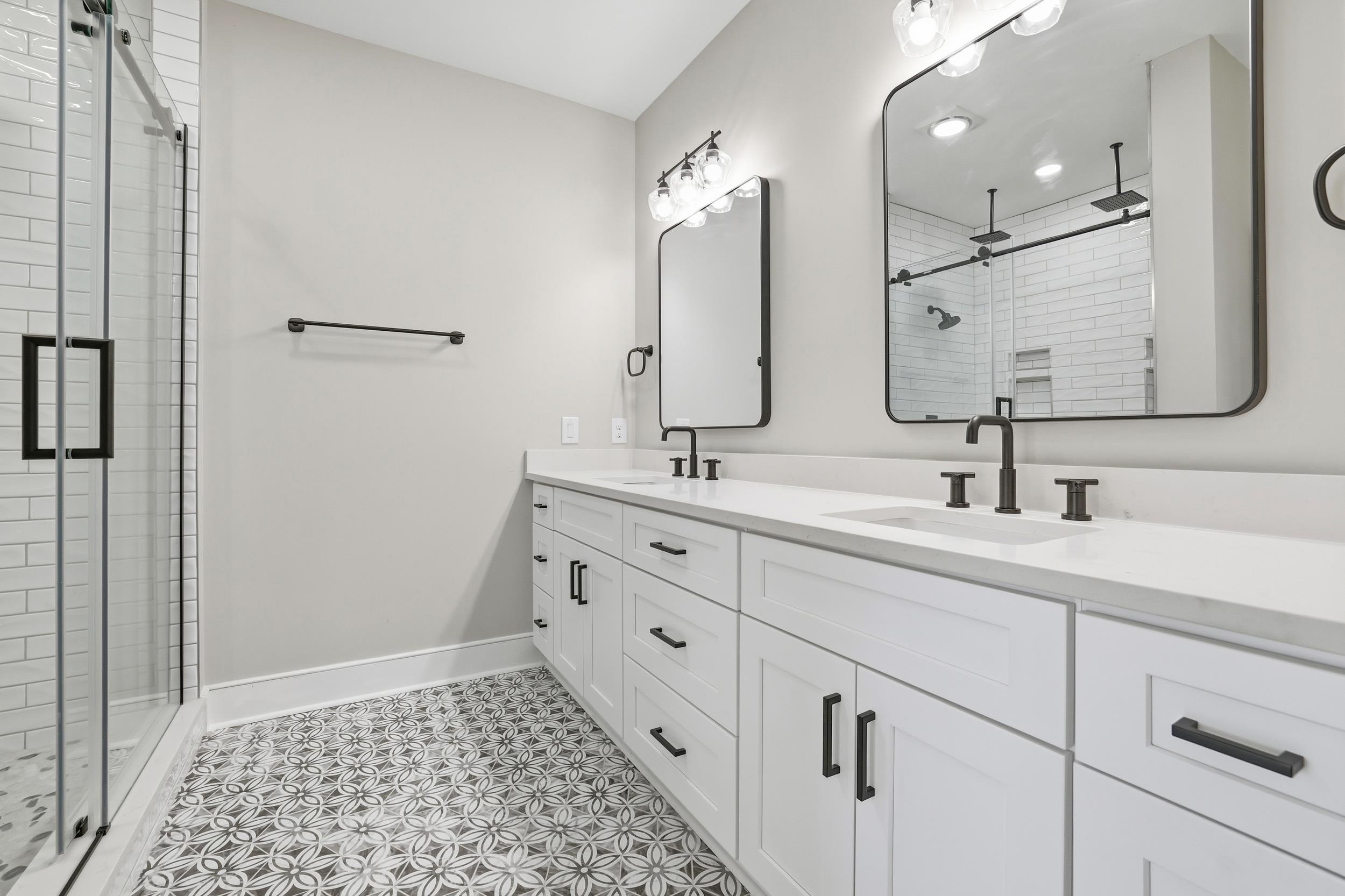 145 Oak Bay Drive Georgetown, SC 29440 - Photo 14 of 39 Bathroom featuring double vanity, a shower stall, and light tile patterned flooring