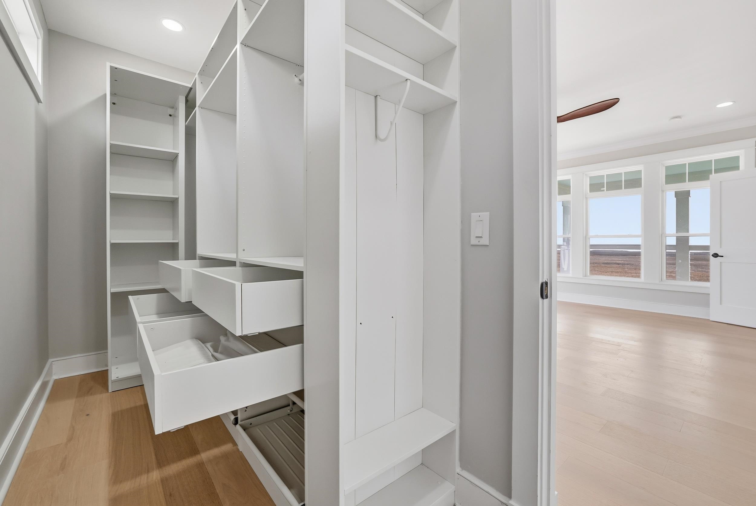 145 Oak Bay Drive Georgetown, SC 29440 - Photo 17 of 39 Spacious closet featuring light wood finished floors and ceiling fan