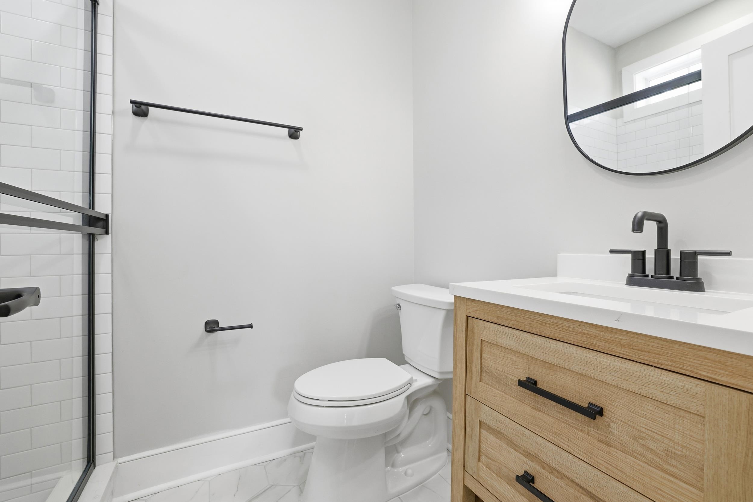 145 Oak Bay Drive Georgetown, SC 29440 - Photo 19 of 39 Bathroom with a stall shower, vanity, and marble finish floors