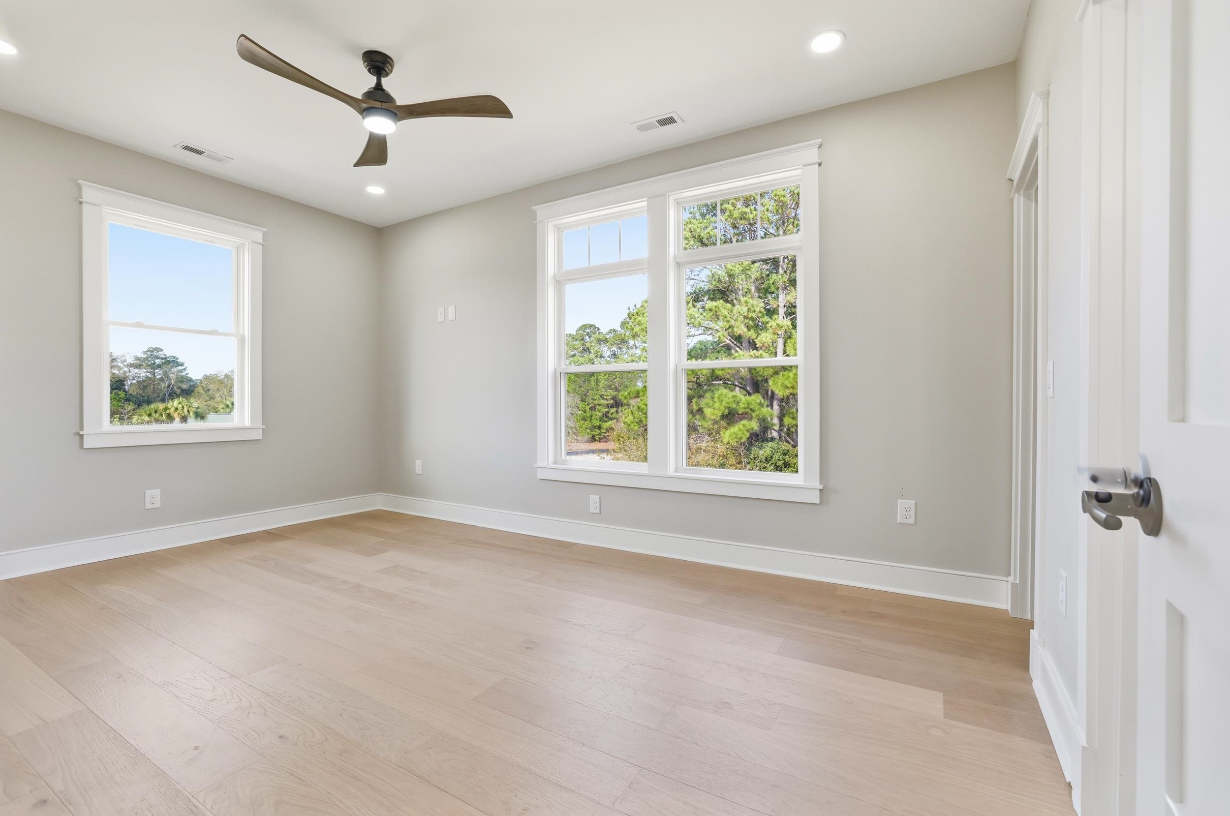 145 Oak Bay Drive Georgetown, SC 29440 - Photo 22 of 39 Empty room featuring light wood flooring, plenty of natural light, a ceiling fan, and recessed lighting