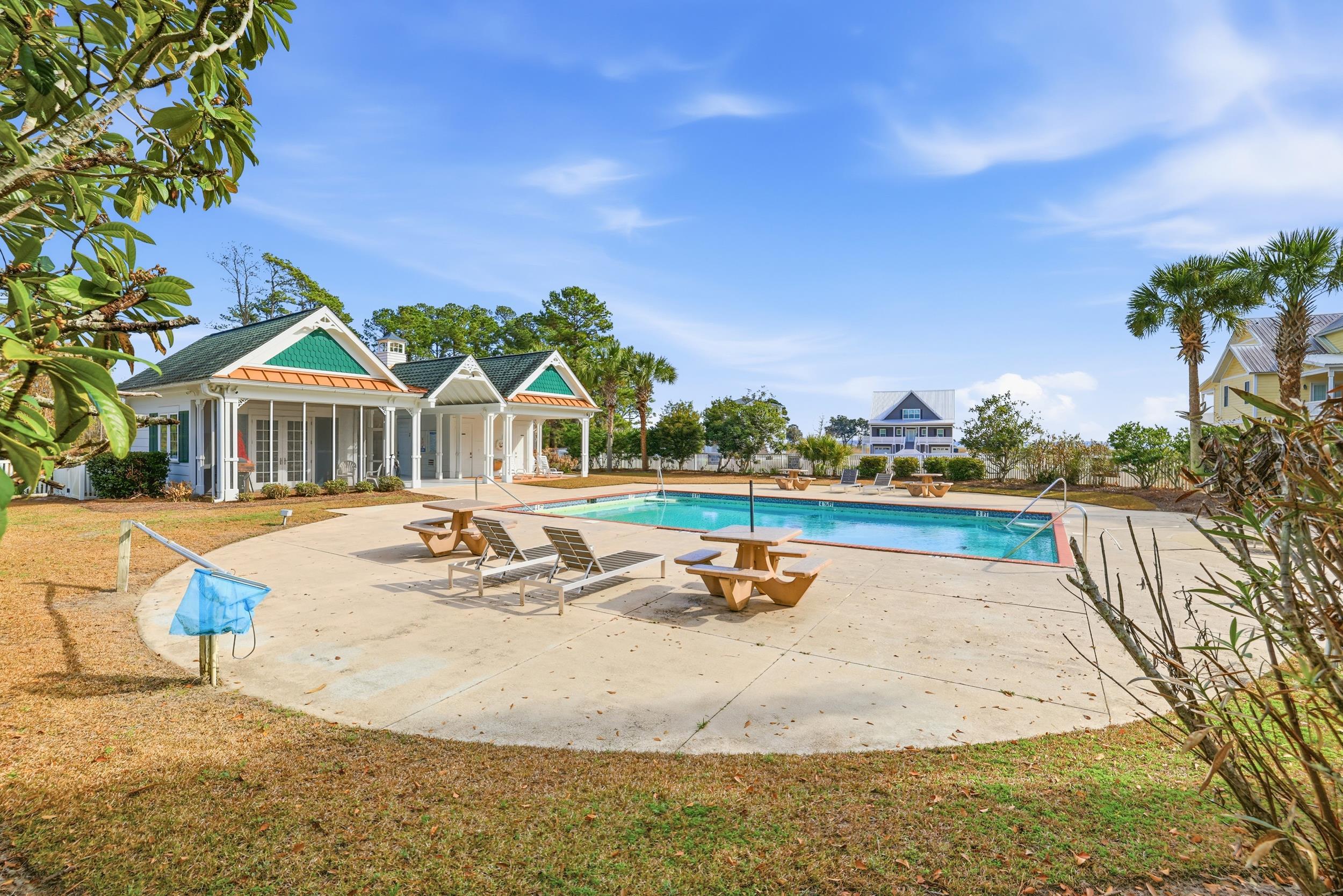 145 Oak Bay Drive Georgetown, SC 29440 - Photo 34 of 39 Community pool featuring a patio area and a yard