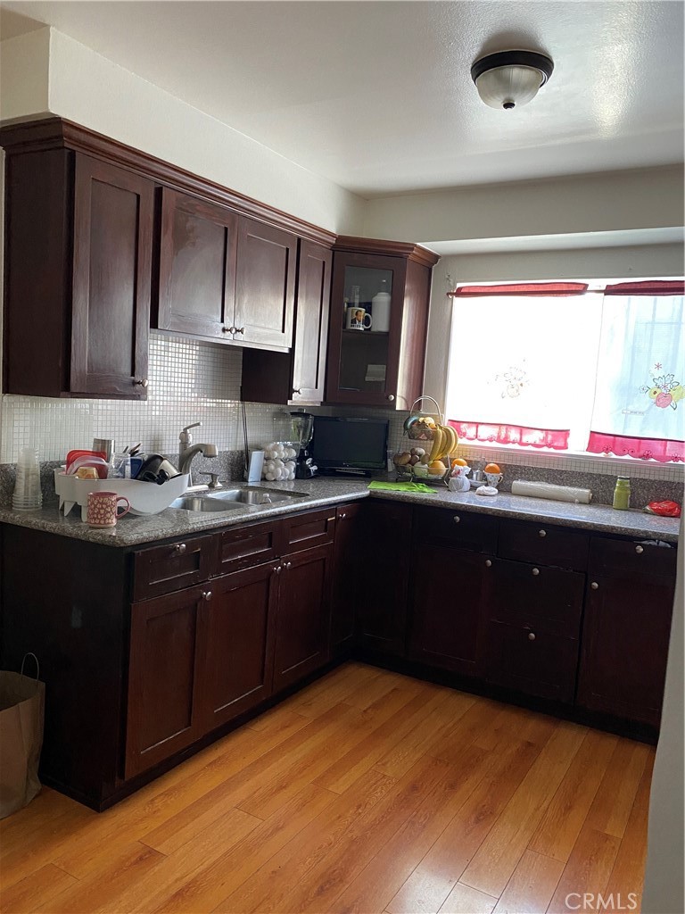 21 Scottsdale Drive Carson, CA 90745 - Photo 1 of 13 a kitchen with a sink wooden cabinets and a stove