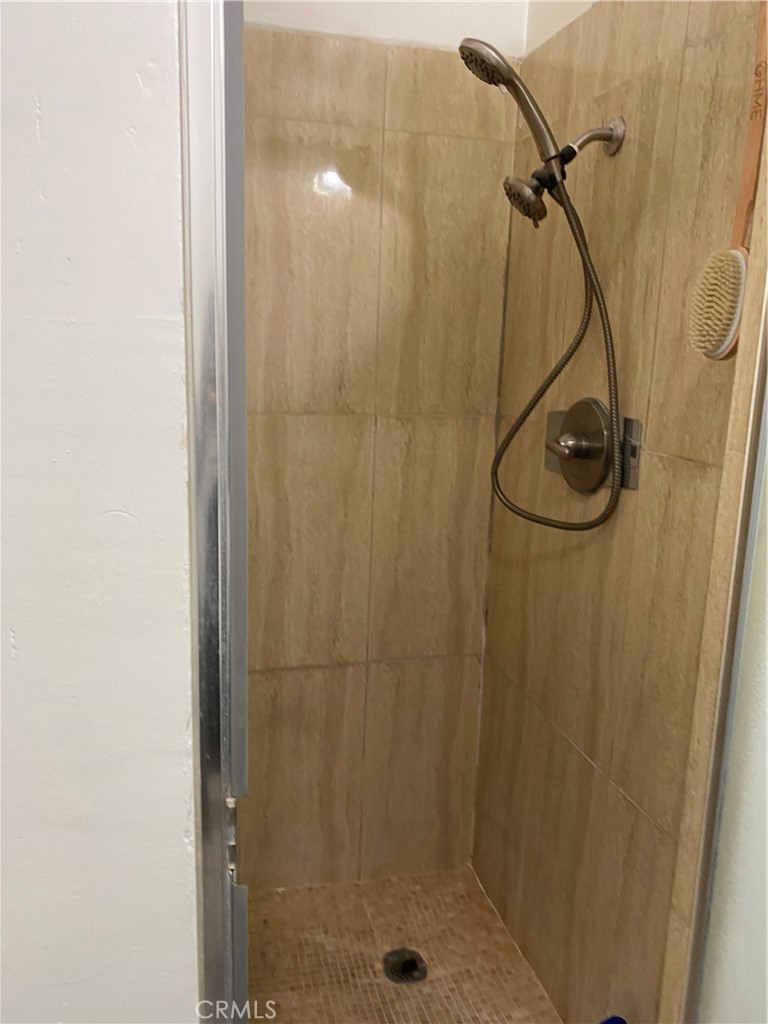 21 Scottsdale Drive Carson, CA 90745 - Photo 9 of 13 a bathroom that has a glass shower door