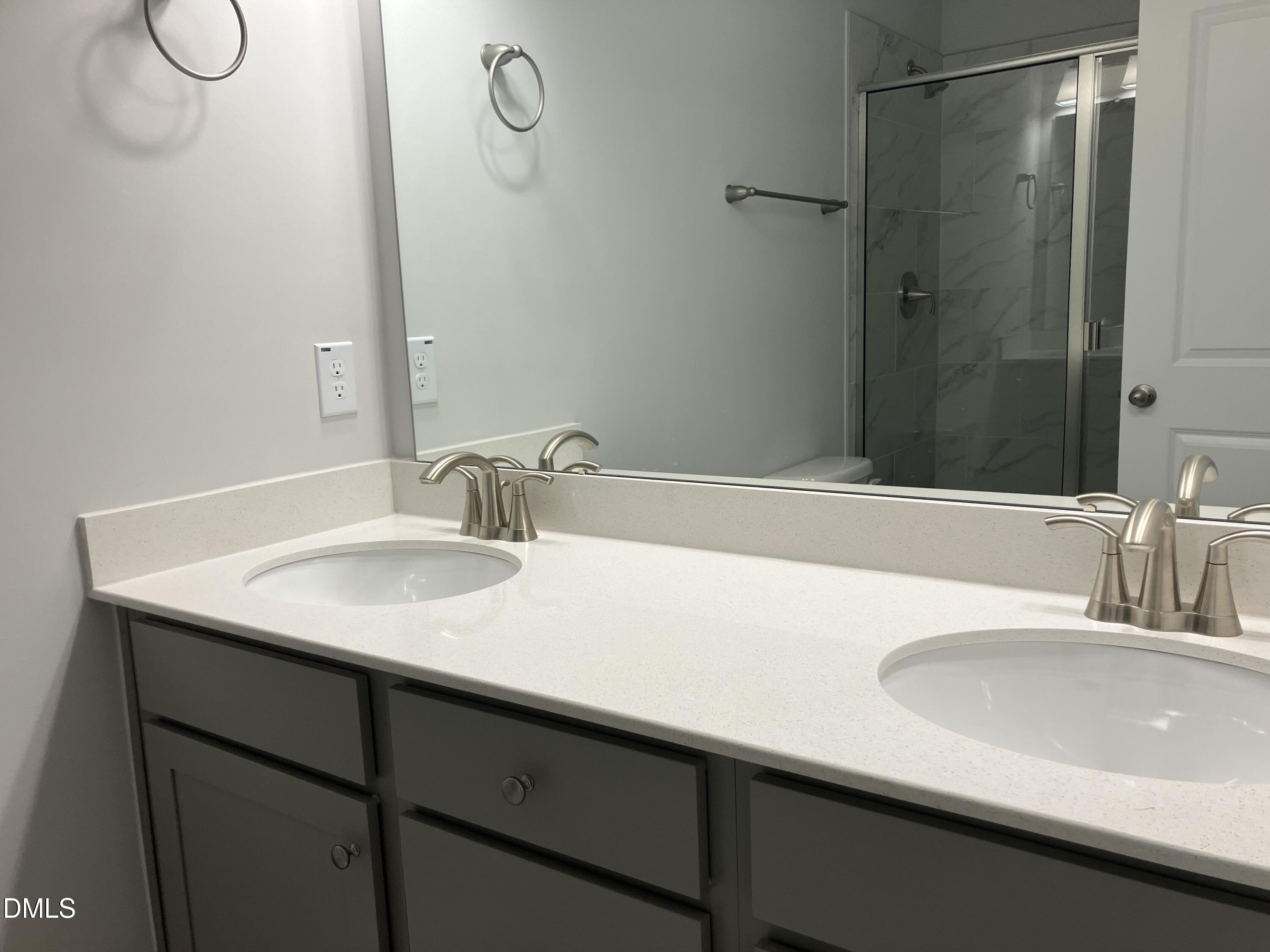 2042 Fishamble Street Fuquay-Varina, NC 27526 - Photo 13 of 15 a bathroom with a sink and a mirror
