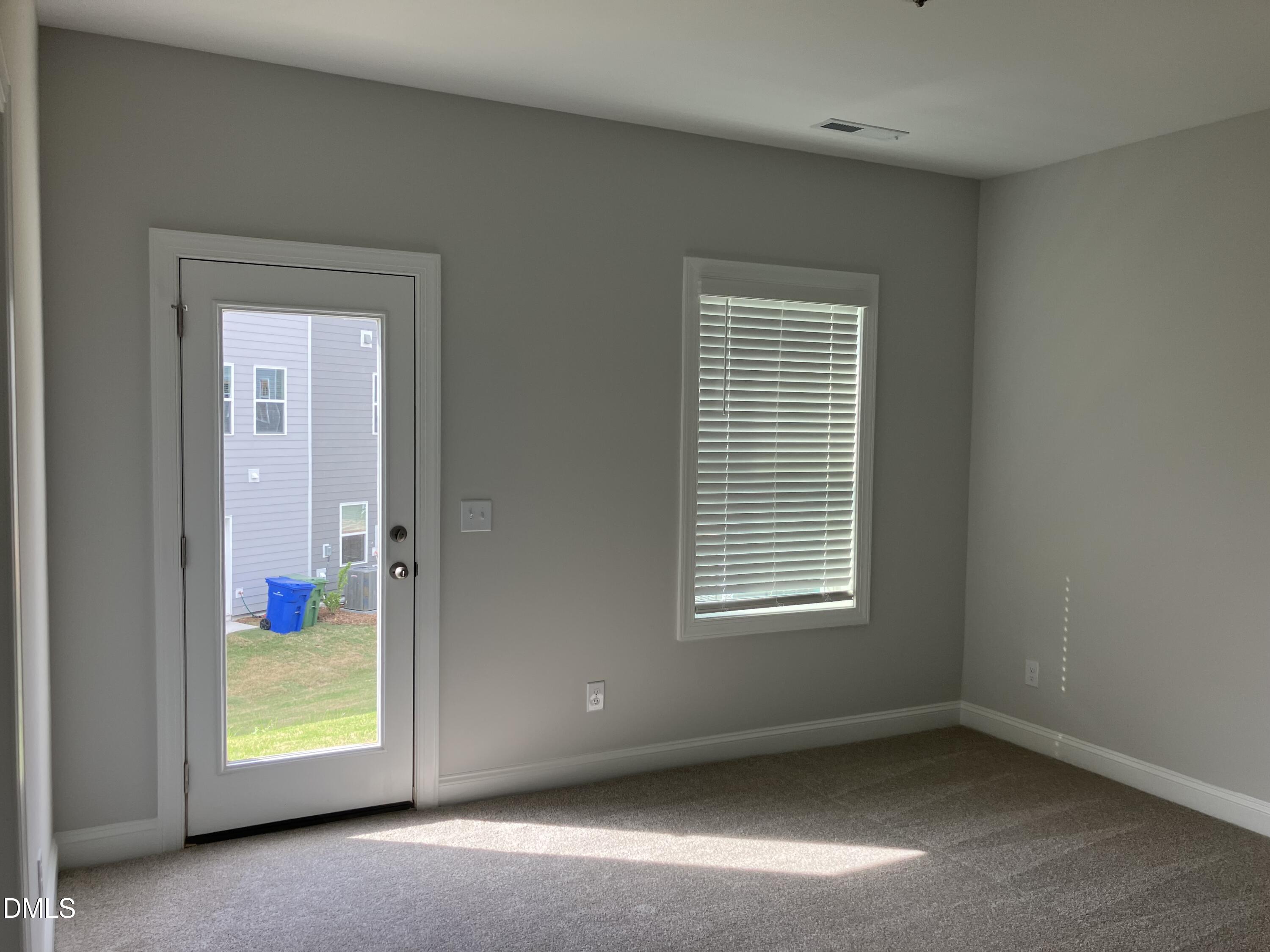 2042 Fishamble Street Fuquay-Varina, NC 27526 - Photo 3 of 15 an empty room with windows
