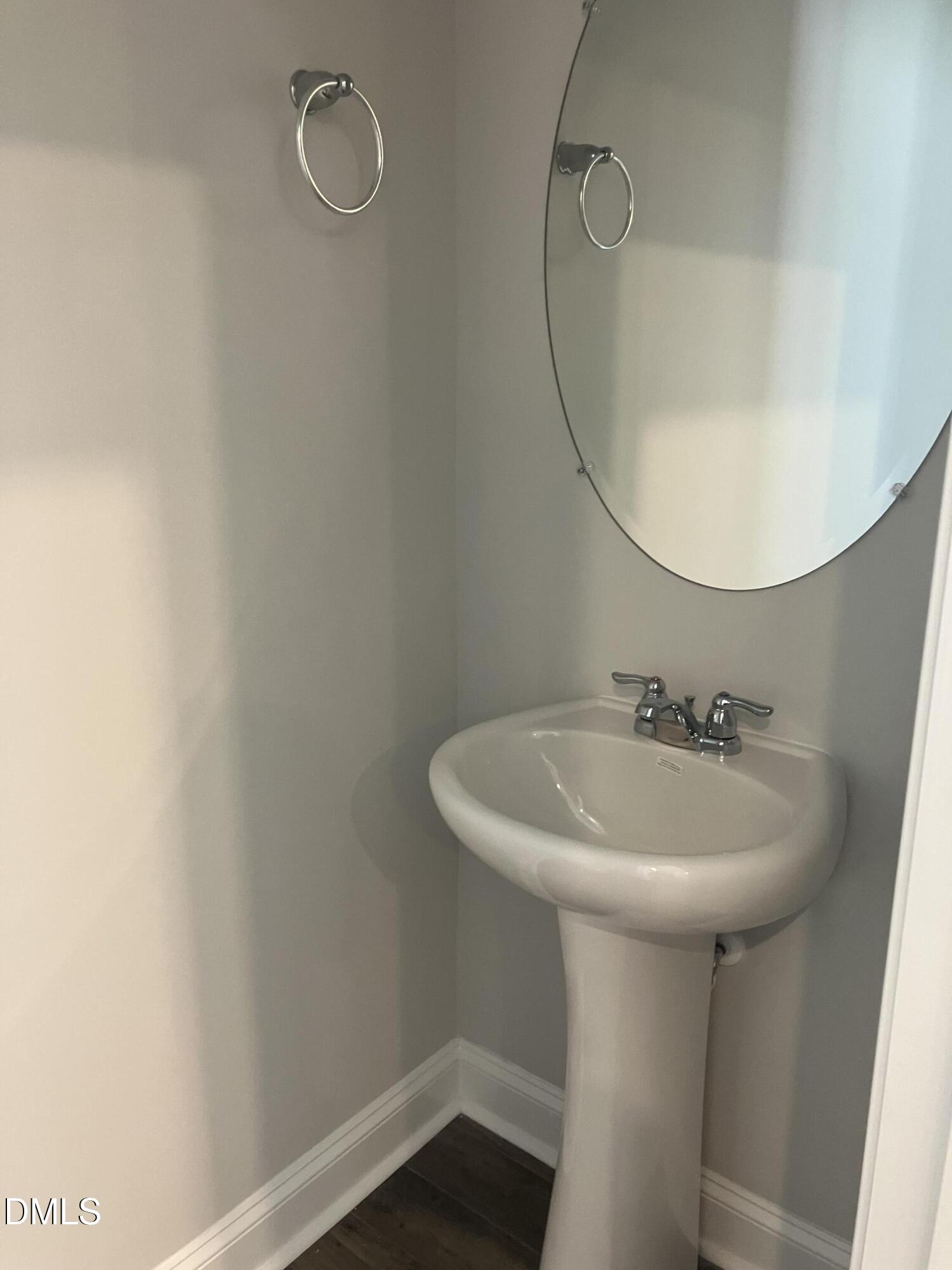 2042 Fishamble Street Fuquay-Varina, NC 27526 - Photo 8 of 15 a bathroom with a sink a mirror and a vanity