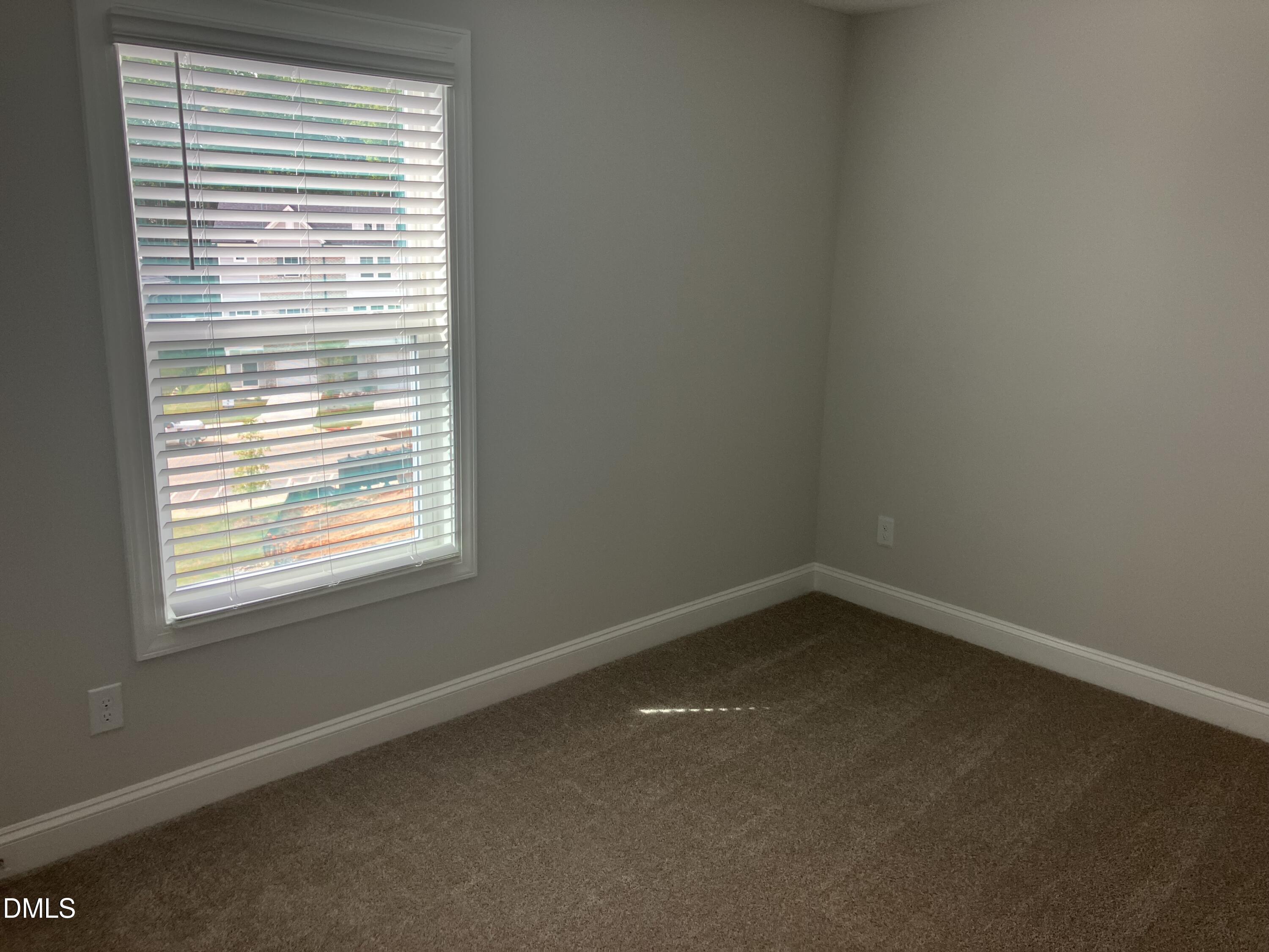2042 Fishamble Street Fuquay-Varina, NC 27526 - Photo 10 of 15 an empty room with a window