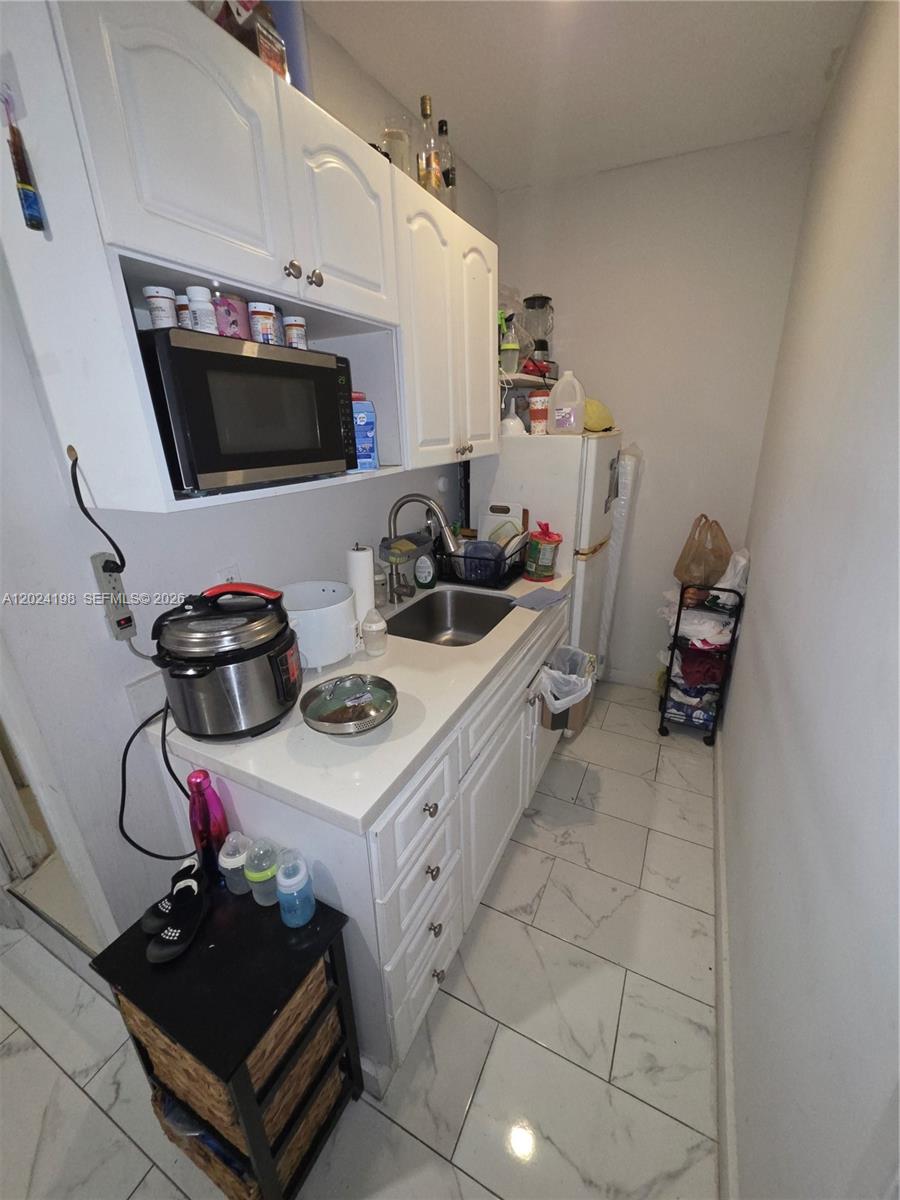 651 East 48th Street Hialeah, FL 33013 - Photo 43 of 52 a room with storage and utility