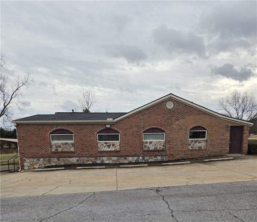a front view of a house with garage