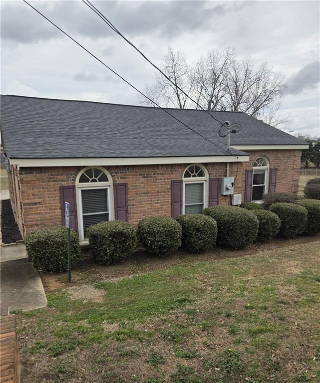 293 North Broad Street Winder, GA 30680 - Photo 2 of 10 a view of a house with a yard plants and a table and chairs