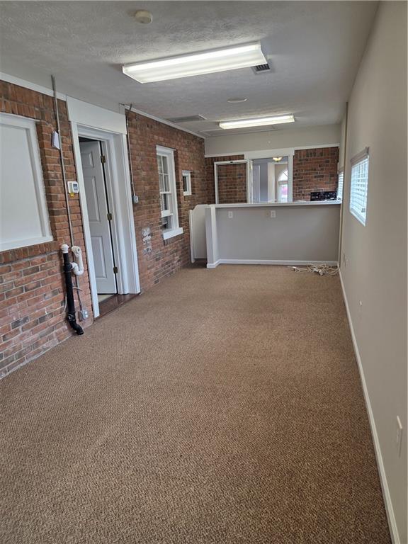 293 North Broad Street Winder, GA 30680 - Photo 3 of 10 a view of a big room with wooden floor and windows