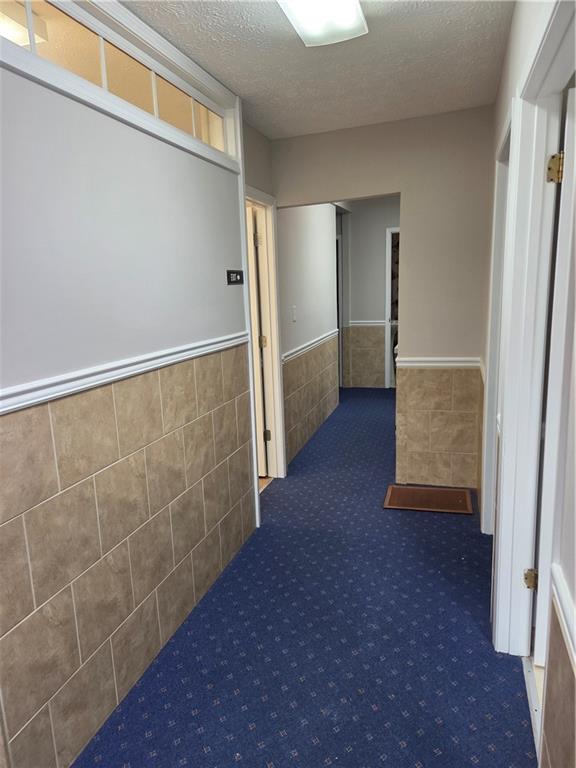 293 North Broad Street Winder, GA 30680 - Photo 4 of 10 a view of an empty room with wooden floor and a window