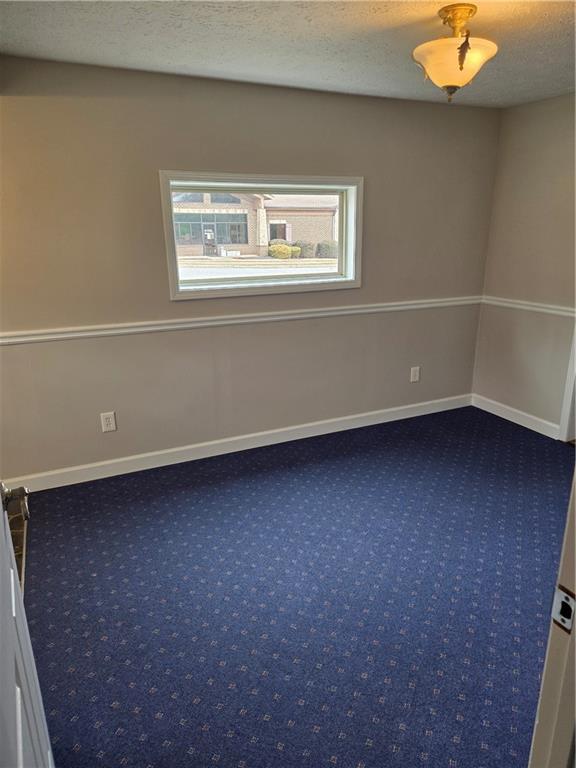 293 North Broad Street Winder, GA 30680 - Photo 5 of 10 an empty room with a window