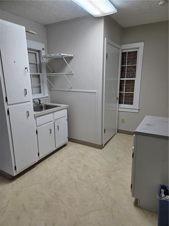 293 North Broad Street Winder, GA 30680 - Photo 9 of 10 a view of storage and utility room with washer and dryer