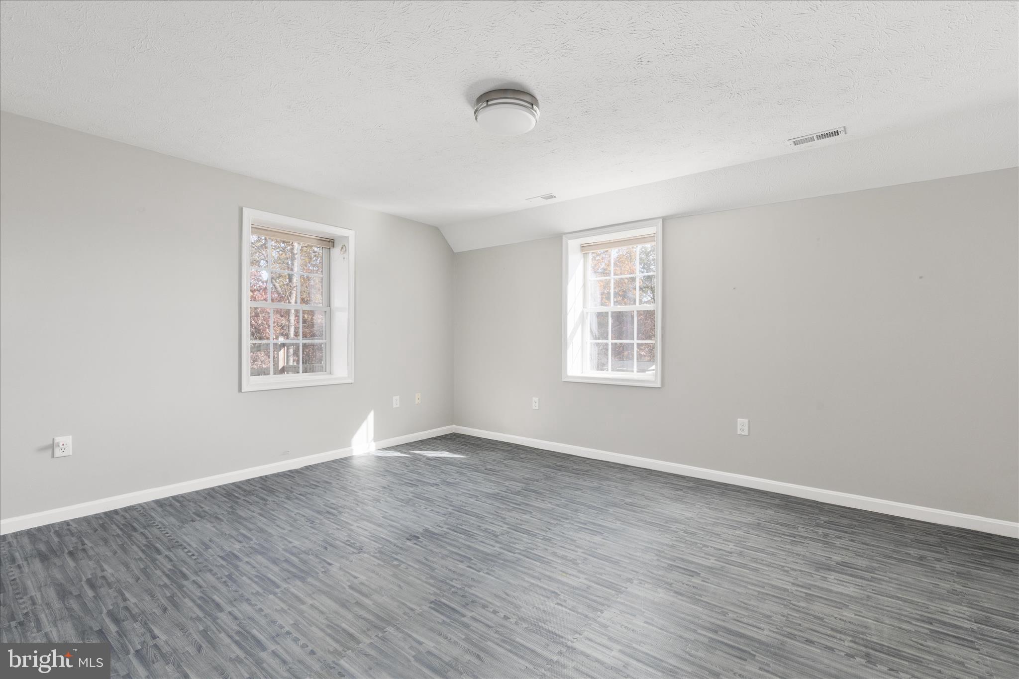 1286 Three Run Road Inwood, WV 25428 - Photo 39 of 74 a view of an empty room with wooden floor and a window