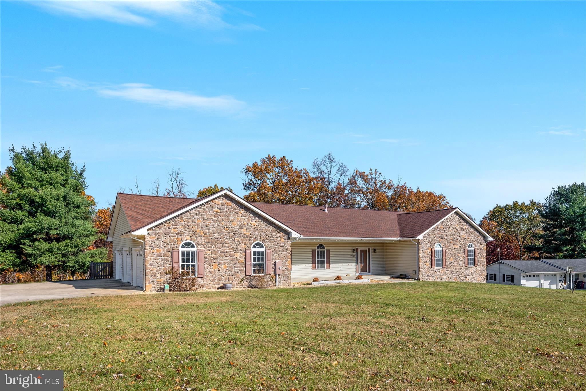 1286 Three Run Road Inwood, WV 25428 - Photo 55 of 74 a front view of house with yard and trees in the background
