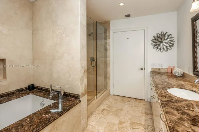 a view of empty room with wooden floor and cabinet