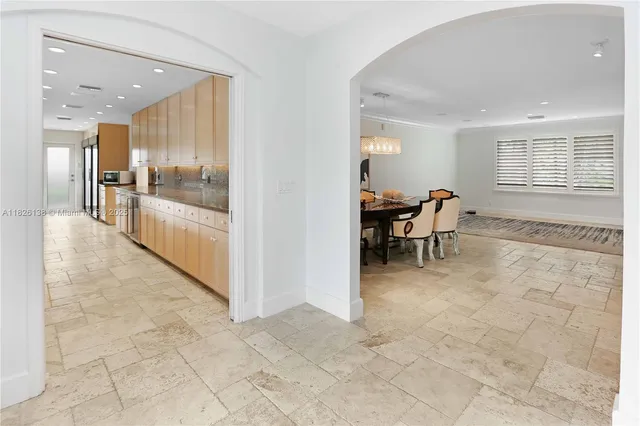 a view of a hallway with a cabinet and a mirror