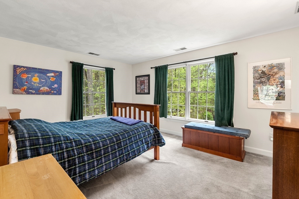 37 Old Planters Road Beverly, MA 01915 - Photo 28 of 42 a bedroom with a bed and glass window