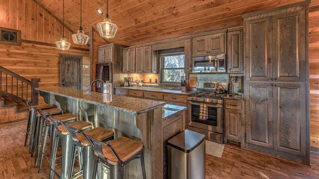 a living room with lots of furniture and wooden floor
