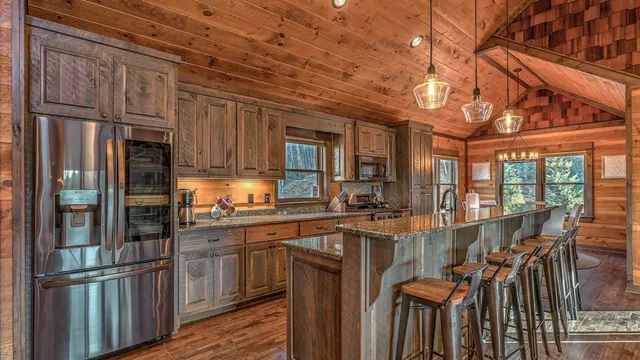 a view of a dining room with furniture large windows and wooden floor