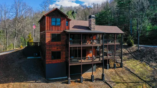 a outdoor living space with patio furniture and a fireplace
