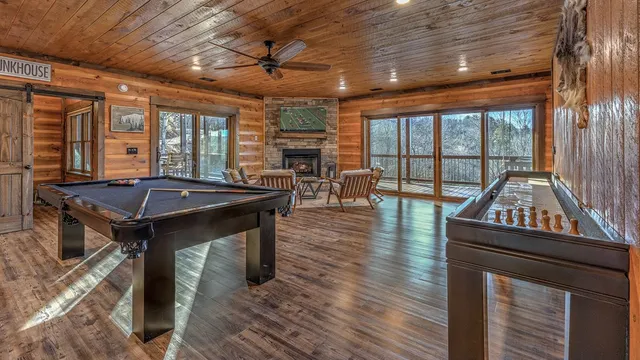 a patio with table and chairs and potted plants