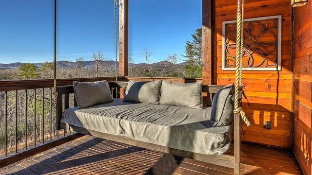 a view of a chairs and table in the balcony