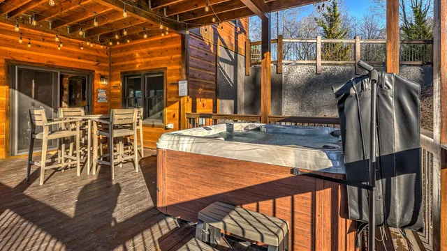 a view of a balcony with chairs and wooden floor
