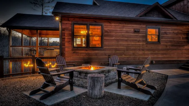 a living room with furniture a fireplace and a floor to ceiling window