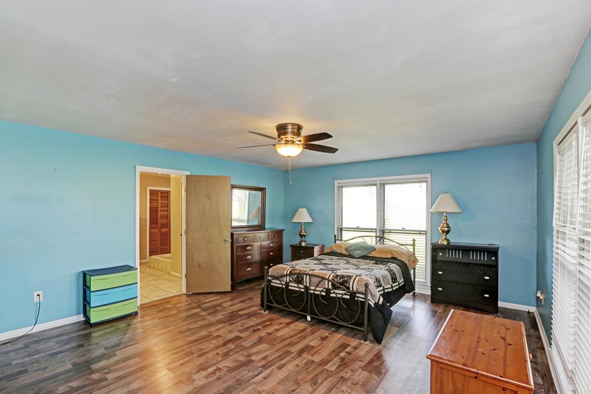 52 Power Station Road Taft, TN 38488 - Photo 16 of 30 a bedroom with a bed and wooden floor
