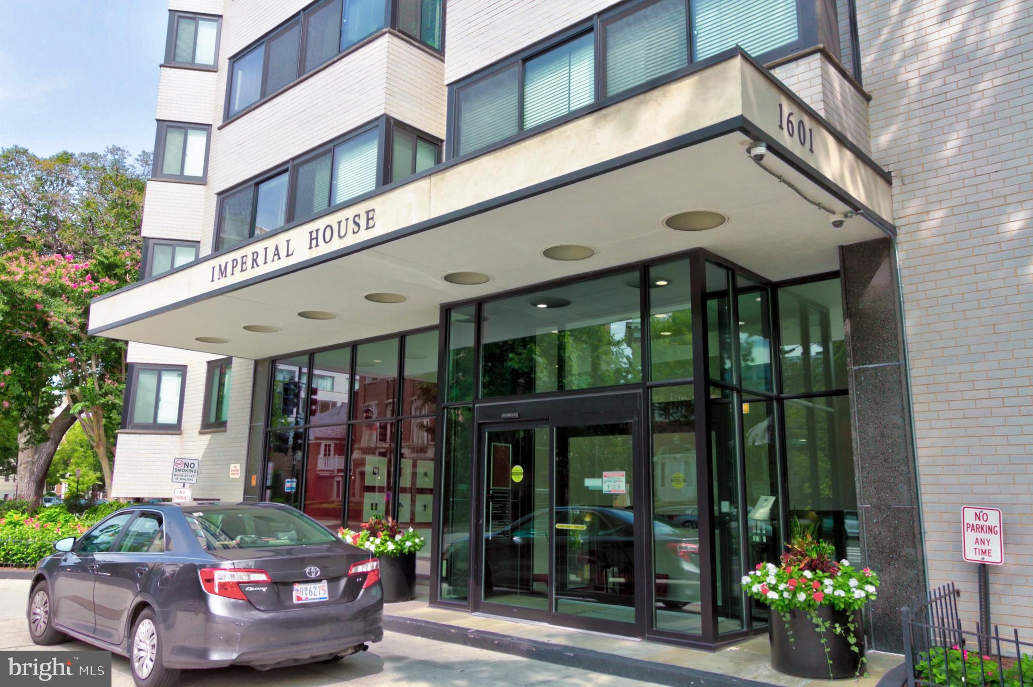 1601 18th Street Northwest, Unit 508 Washington, DC 20009 - Photo 3 of 31 a front view of a building with outdoor seating and plants