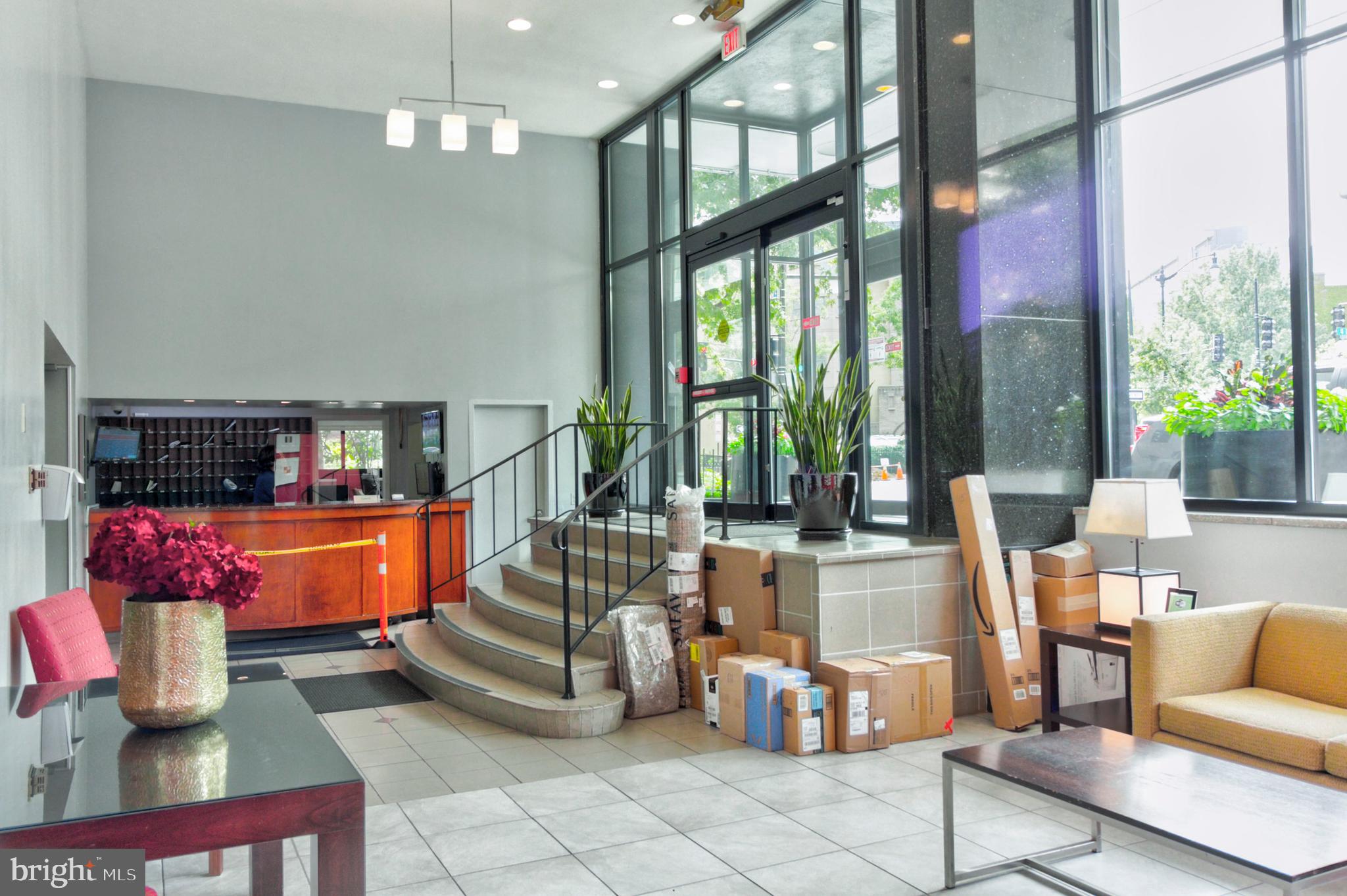 1601 18th Street Northwest, Unit 508 Washington, DC 20009 - Photo 4 of 31 a living room with furniture large window and potted plants