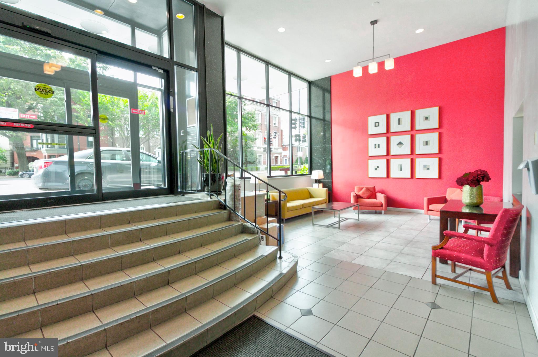 1601 18th Street Northwest, Unit 508 Washington, DC 20009 - Photo 6 of 31 a bedroom with a bed and large windows